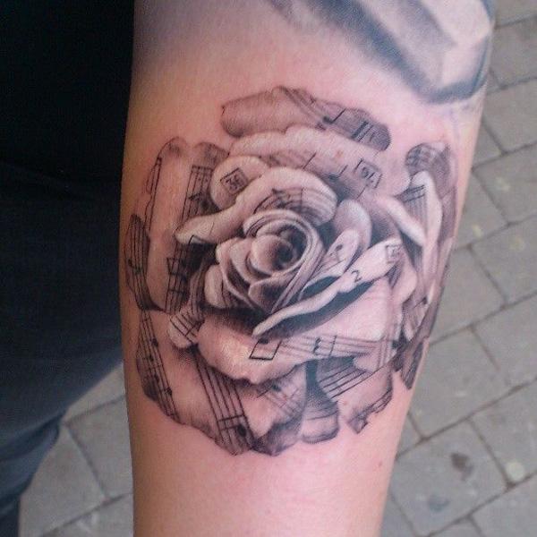 Noter rose Forearm Tattoo