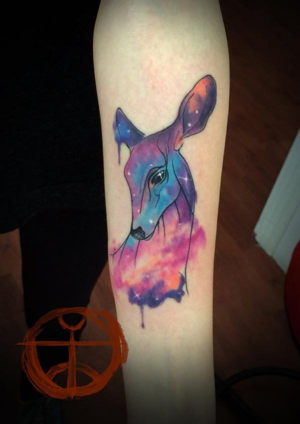 Galaxy Unicorn tatovering på underarmen