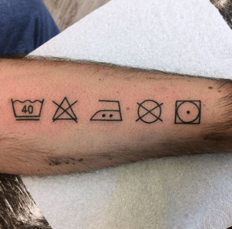 tatovering av symboler for vaskeri